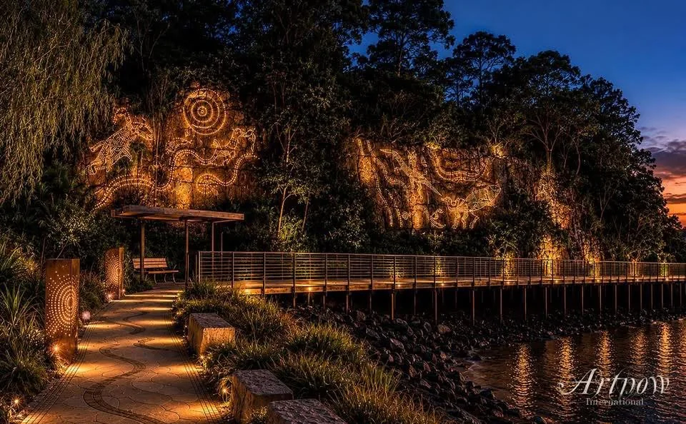 Night-time concept visualisation with cliff lighting, boardwalk, foreshore planting, shelter and seating beside the water